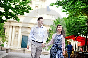 Happy positive couple walking near Sorbonne