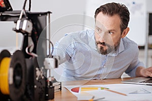 Happy positive man working with 3d technology