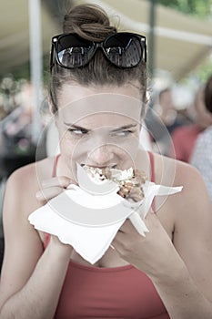 Happy preatty girl or Woman eating sandwich gyros.