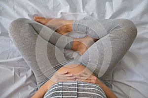 Happy pregnancy and maternity concept. Top view of young Caucasian woman