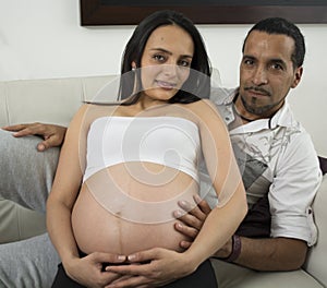 Happy pregnant couple expecting their baby.