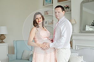 Happy pregnant couple. Pregnancy, maternity, preparation