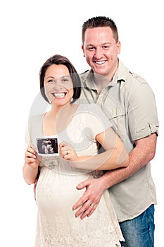Happy pregnant couple with ultrasound picture