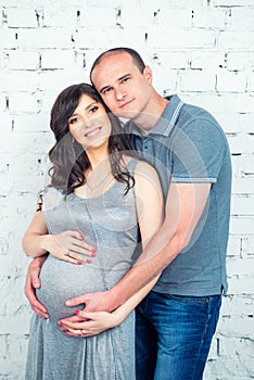 Happy pregnant couple waiting for a miracle