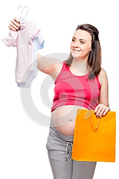 happy pregnant lady chooses body for a boy or girl on a white