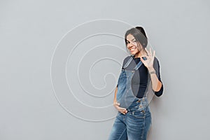 Happy pregnant lady make okay gesture