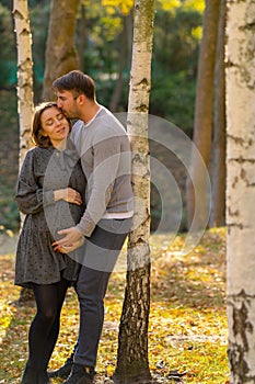 Happy pregnant woman bonding with her husband