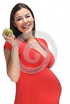 Happy pregnant woman with green apple
