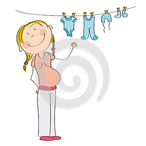 Happy pregnant woman hanging clothes for her unborn baby boy