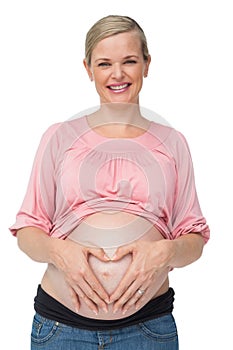 Happy pregnant woman with her hands on her belly