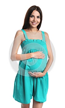 Happy pregnant woman holding  belly on white background