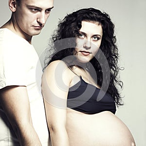 Happy pregnant woman with husband