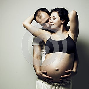 Happy pregnant woman with husband