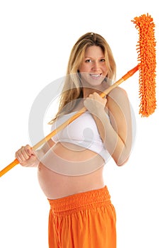 Happy pregnant woman with a mop and brush