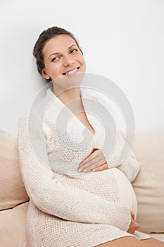 Happy Pregnant woman over white background