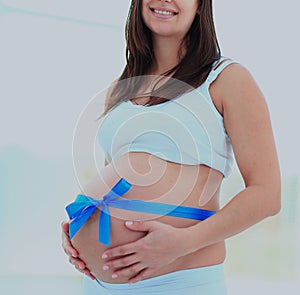 Happy pregnant woman smiling. looking at the camera