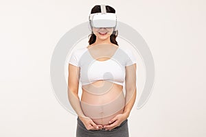 Happy Pregnant Woman standing smile and stroking big belly with love isolated on white background,Pregnancy of young woman enjoy