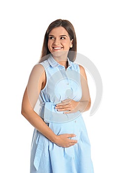 Happy pregnant woman touching her belly