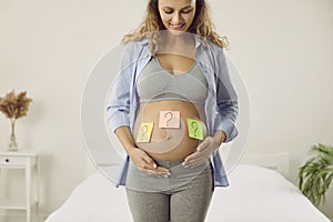 Happy pregnant woman wonder about baby gender