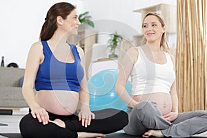 Happy pregnant women training together