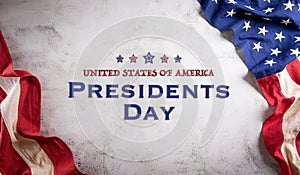 Happy presidents day concept with flag of the United States on old stone background photo