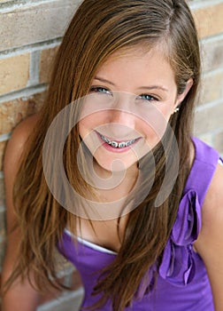 Happy preteen girl with braces