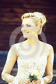 Happy pretty cute bride with beautiful makeup in wedding dress