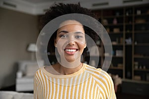 Happy pretty young African American woman home head shot portrait