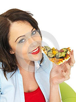 Happy Pretty Young Woman Eating a Slice of Freshly Baked Vegetarian Pizza