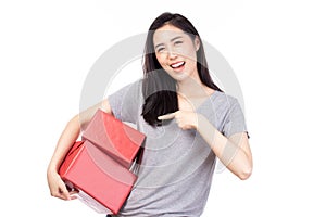 Happy pretty young woman holding gift box present in christmas or new year on white background