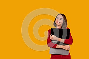 Happy pretty young woman hugging laptop with blank screen