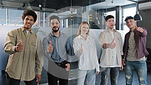 Happy professional confident group diverse people corporate employees standing in row looking at camera smiling showing