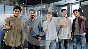 Happy professional confident group diverse people corporate employees standing in row looking at camera smiling showing