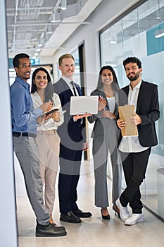 Happy professional team diverse business people in office. Vertical portrait.