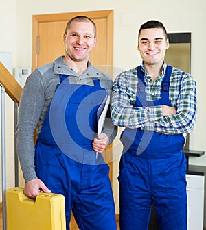 Happy professional workers in uniform