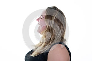 Happy profile side woman portrait Plus Size Model with blond long hair open mouth white background