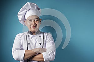 Happy Proud Asian Chef Smiling at Camera With Crossed Arms