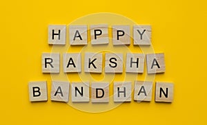 Happy Raksha Bandhan, a minimalistic banner with an inscription in wooden letters