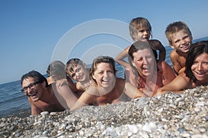 Happy real people relaxing on the beach