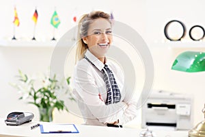 Happy receptionist working in hotel