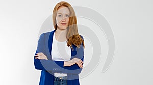 Happy red haired business woman in template blank white t shirt and stylish jacket isolated on gray background. Self career