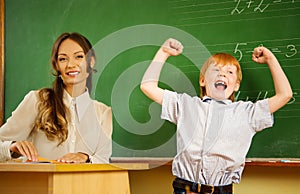 Happy redhead boy in school