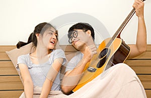 Happy relationship couple lovely activity. Asian lover using freetime on holiday together at home.