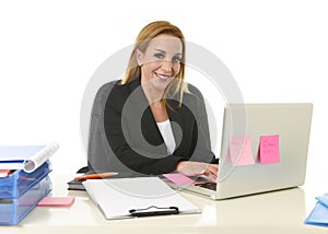 Happy relaxed 40s businesswoman smiling confident working at lap