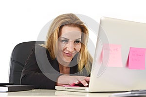 Happy relaxed 40s businesswoman smiling confident working at lap
