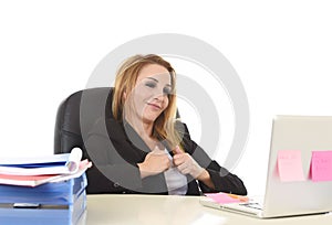 Happy relaxed 40s businesswoman smiling confident working at lap