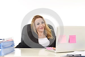 Happy relaxed 40s businesswoman smiling confident working at laptop computer