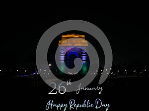 Happy Republic Day of India with India gate illuminating tricolor lights.