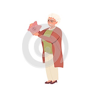 Happy retired elderly woman character holding piggy bank standing isolated on white background