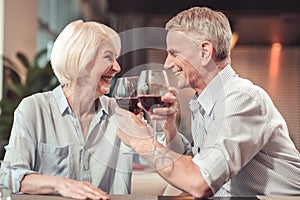 Happy retired man and woman laughing together